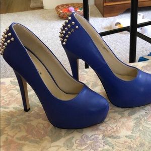 Cobalt blue leather pumps with metal accents